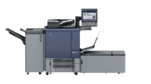 A large printer with a large screen on the side.