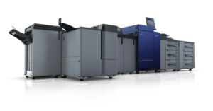 A group of large printers in a room.