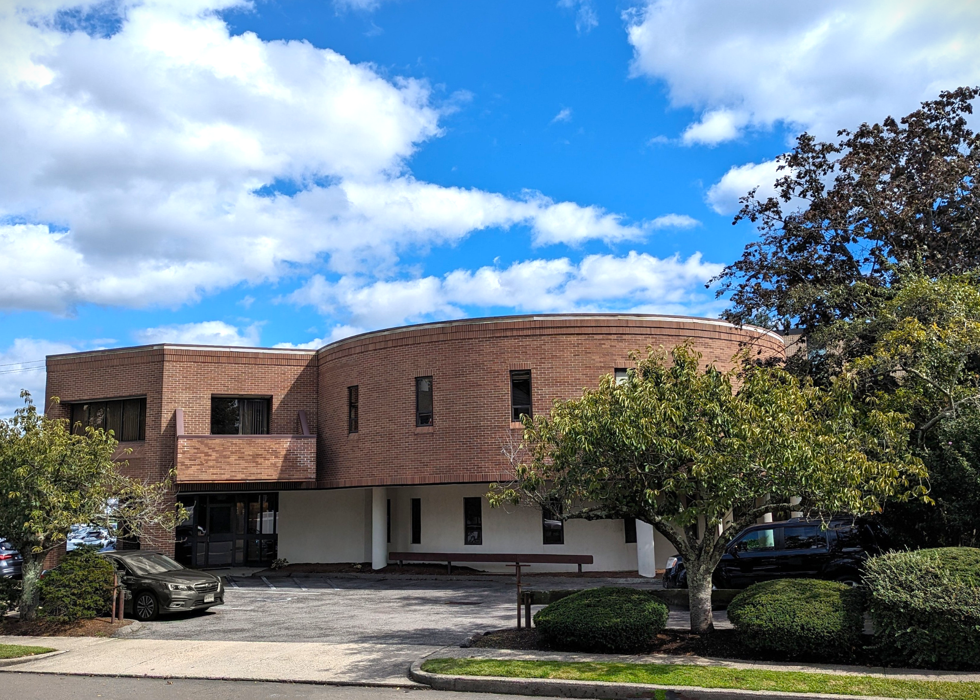 A large building with a tree in front of it.